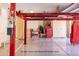 Garage with four-post car lift (lift and tools not included) at 15972 N 115Th Way, Scottsdale, AZ 85255