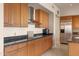 Modern kitchen with stainless steel appliances and wood cabinets at 15972 N 115Th Way, Scottsdale, AZ 85255