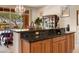 Kitchen features granite countertops and a breakfast bar at 15972 N 115Th Way, Scottsdale, AZ 85255