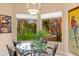 Breakfast nook with glass-top table and views of the backyard at 15972 N 115Th Way, Scottsdale, AZ 85255