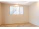 Bright bedroom with wood-look flooring and window at 15972 N 115Th Way, Scottsdale, AZ 85255