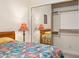 Bedroom with double bed, mirrored closet doors and window at 15972 N 115Th Way, Scottsdale, AZ 85255