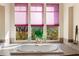 Bathroom with large bathtub and garden views at 15972 N 115Th Way, Scottsdale, AZ 85255