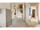 Elegant staircase leading to upper level of home at 15972 N 115Th Way, Scottsdale, AZ 85255