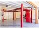 Garage with four-post car lift (lift and tools not included) at 15972 N 115Th Way, Scottsdale, AZ 85255