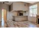 Small kitchenette with granite countertop and built-in bar at 15972 N 115Th Way, Scottsdale, AZ 85255