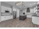Modern kitchen with a large island and stainless steel appliances at 2452 E Aloe Pl, Chandler, AZ 85286