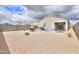 Relaxing backyard oasis with hot tub, patio, and seating area at 17078 N Rosemont St, Maricopa, AZ 85138