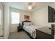 Bedroom with mounted TV and comfortable bed at 17078 N Rosemont St, Maricopa, AZ 85138