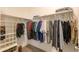 Well-organized closet with shelving and hanging rods at 17078 N Rosemont St, Maricopa, AZ 85138