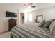 Comfortable bedroom with king-size bed and ensuite bathroom access at 17078 N Rosemont St, Maricopa, AZ 85138