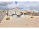 Spacious backyard with patio, hot tub, and seating area at 17078 N Rosemont St, Maricopa, AZ 85138
