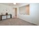Open and bright entryway with a decorative wall and high ceilings at 17078 N Rosemont St, Maricopa, AZ 85138