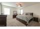 Bright bedroom with king-size bed and ensuite bathroom at 17078 N Rosemont St, Maricopa, AZ 85138