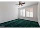 Bedroom with green carpet, ceiling fan and window shutters at 5415 E Mckellips Rd # 56, Mesa, AZ 85215