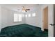 Bedroom with green carpet, ceiling fan and window shutters at 5415 E Mckellips Rd # 56, Mesa, AZ 85215