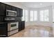 Kitchen features dark wood cabinets, granite countertops, and stainless steel appliances at 5415 E Mckellips Rd # 56, Mesa, AZ 85215