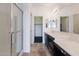 Double vanity bathroom with large shower and dark cabinets at 5415 E Mckellips Rd # 56, Mesa, AZ 85215