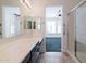 Bathroom with double vanity, shower and view of bedroom at 5415 E Mckellips Rd # 56, Mesa, AZ 85215