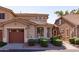 Two story home with attached garage and manicured landscaping at 5415 E Mckellips Rd # 56, Mesa, AZ 85215