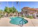 Community pool with a spa and lounge chairs at 5415 E Mckellips Rd # 56, Mesa, AZ 85215