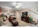 Cozy living room featuring a fireplace, comfortable seating, and a large TV at 1765 S Fairway Cir, Casa Grande, AZ 85194