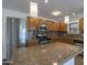 Updated kitchen with wood cabinets and granite island at 1916 E Clarendon Ave, Phoenix, AZ 85016