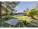 Artificial turf backyard, with patio and home exterior at 1916 E Clarendon Ave, Phoenix, AZ 85016