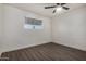 Bright bedroom featuring ceiling fan and gray vinyl flooring at 18202 Cave Creek Rd # 129, Phoenix, AZ 85032