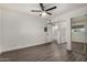 Bedroom with wood-look floors, mirrored closet, and access to bathroom at 18202 Cave Creek Rd # 111, Phoenix, AZ 85032
