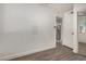 Spacious bedroom with wood-look floors and access to kitchen at 18202 Cave Creek Rd # 111, Phoenix, AZ 85032