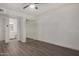 Bedroom with wood-look floors, mirrored closet and bathroom access at 18202 Cave Creek Rd # 111, Phoenix, AZ 85032