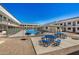 Community pool with patio tables, grill, and plenty of seating at 18202 Cave Creek Rd # 111, Phoenix, AZ 85032