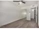 Bedroom with wood-look floors, mirrored closet and bathroom access at 18202 Cave Creek Rd # 111, Phoenix, AZ 85032