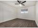 Bright bedroom with wood-look floors and ceiling fan at 18202 Cave Creek Rd # 111, Phoenix, AZ 85032