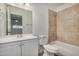Updated bathroom with white vanity and beige tile at 18202 Cave Creek Rd # 111, Phoenix, AZ 85032