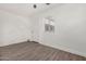 Bedroom with grey vinyl flooring and white door at 18202 Cave Creek Rd # 111, Phoenix, AZ 85032