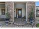 Inviting front entry with stone accents and a charming paved walkway at 530 S Emerson St, Chandler, AZ 85225