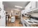 Full view of kitchen with white cabinets and tile floor at 437 E Germann Rd # 68, San Tan Valley, AZ 85140