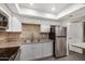 Modern kitchen with white cabinets and granite countertops at 18202 Cave Creek Rd # 251, Phoenix, AZ 85032