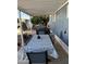 Covered patio with table, chairs, and grill; perfect for outdoor dining at 4065 E University Dr # 300, Mesa, AZ 85205
