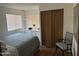 Cozy bedroom with wood floors and ample closet space at 4065 E University Dr # 300, Mesa, AZ 85205