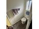 Clean bathroom with toilet and wood-look floors at 4065 E University Dr # 300, Mesa, AZ 85205