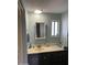 Bathroom with vanity and decorative mirror at 4065 E University Dr # 300, Mesa, AZ 85205