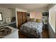 Comfortable bedroom with gray bedding and nightstand at 4065 E University Dr # 300, Mesa, AZ 85205