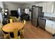 Open kitchen with stainless steel appliances and yellow table set at 4065 E University Dr # 300, Mesa, AZ 85205