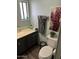 Bathroom with dark vanity and toilet at 4065 E University Dr # 300, Mesa, AZ 85205