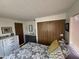 Main bedroom with gray bedding and built-in dresser at 4065 E University Dr # 300, Mesa, AZ 85205