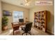 Home office with built-in shelving and a large desk at 2450 W Turtle Hill Dr, Anthem, AZ 85086