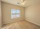 Bright bedroom with large window and wood-look floors at 2450 W Turtle Hill Dr, Anthem, AZ 85086